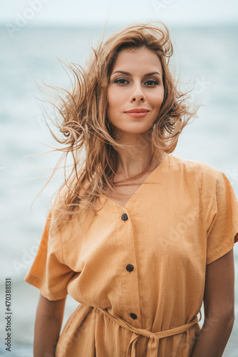 A portrait of blonde woman with ice cream