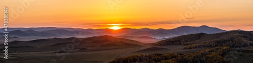 Beautiful mountain natural scenery at sunrise in autumn Ulan Butong grassland scenery in Inner Mongolia China.