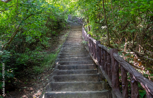 Stairs on a pathway to waterfalls at Erawan National Park in Kanchanaburi Province Thailand