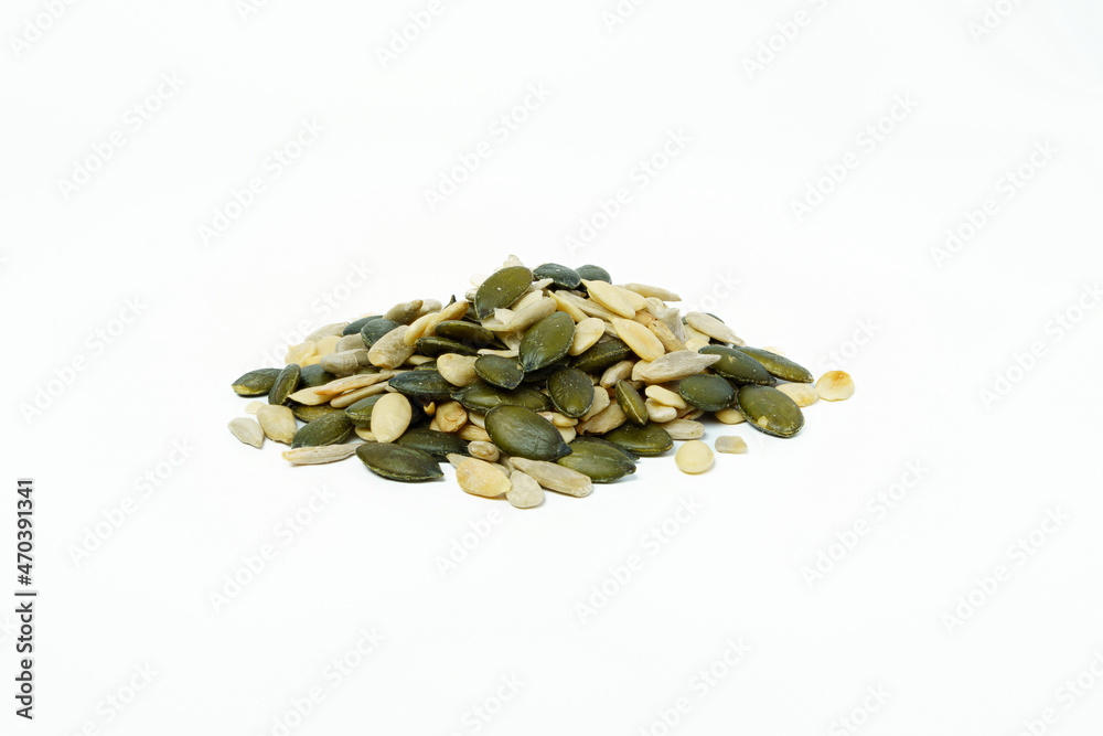 The pile of mixed seeds (Sunflower, pumpkin and water melon seed) isolated on white background. The pile of mixed seeds (Sunflower, pumpkin and water melon seed) isolated on white background.