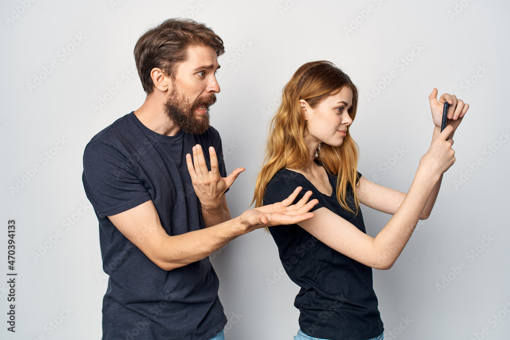 family in black t-shirts phone fun together friendship isolated background family in black t-shirts phone fun together friendship isolated background