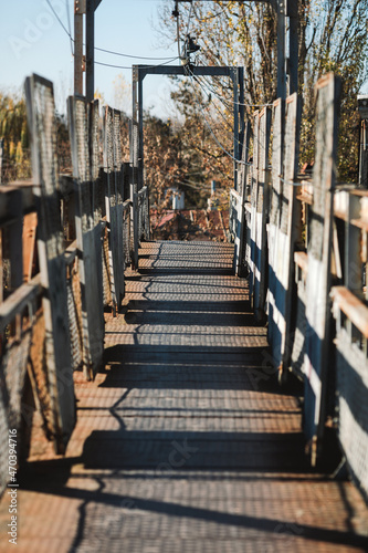 Pedestrian metallic bridge across a railway.