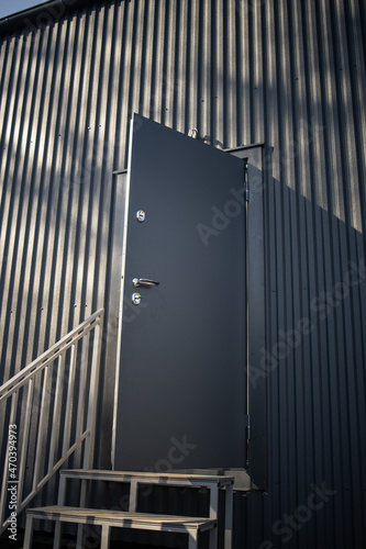 Modern farmhouse, barnhouse, Barn house. Wooden secluded house in the Scandinavian and Finland modern style with large windows. Exterior, metall wall.