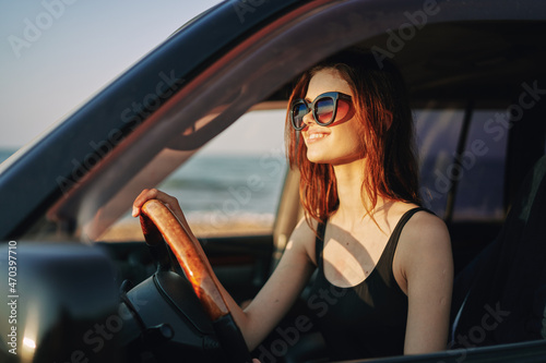 pretty woman in sunglasses driving a car trip © VICHIZH