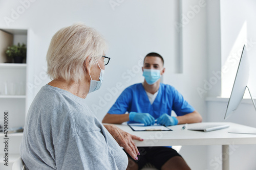 elderly patient at the doctor's and nurse's appointments in the medical office