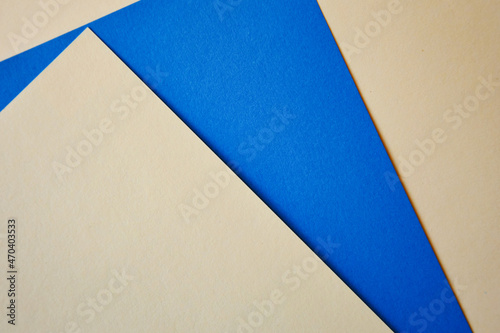 sheets of paper, geometry, abstraction. background for the design. blue, beige colors.
