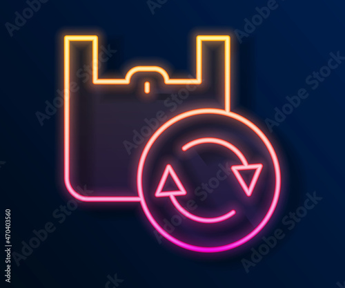 Glowing neon line Paper shopping bag with recycle icon isolated on black background. Bag with recycling symbol. Vector