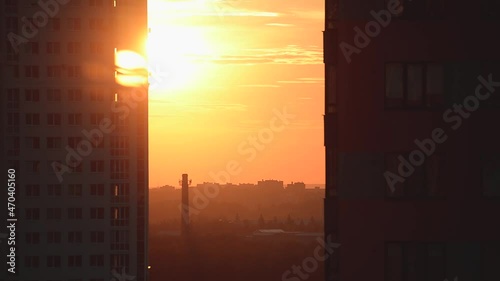 Sunset between two multi-storey buildings