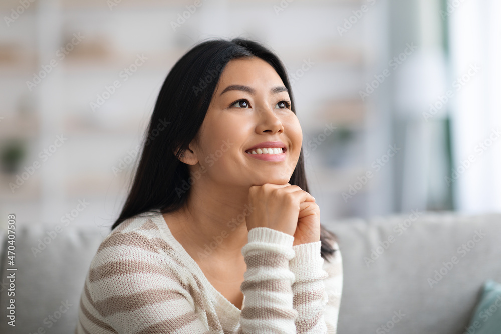 Portrait Of Dreamy Young Beautiful Asian Lady Relaxing In Domestic Interior Portrait Of Dreamy Young Beautiful Asian Lady Relaxing In Domestic Interior