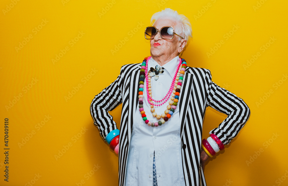 Funny grandmother portraits. Senior old woman dressing elegant for a special event. granny fashion model on colored backgrounds - obrazy, fototapety, plakaty 