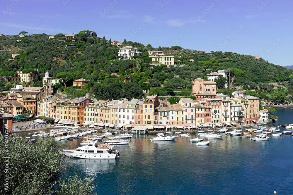Portofino is a fishing village on the Ligurian Riviera south-east of Genoa, pastel-colored houses overlooking the cobbled square overlooking the harbor