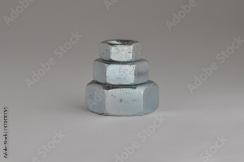 Pyramid of three nuts. Close-up.