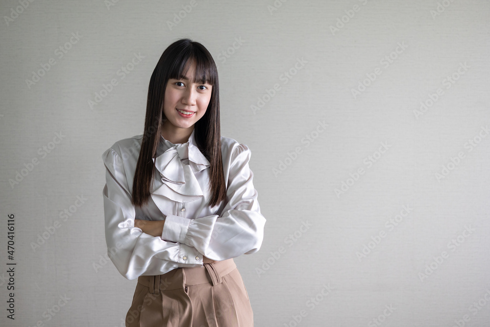 Portrait young asian businesswoman looking at the camera standing in modern office. Portrait young asian businesswoman looking at the camera standing in modern office.
