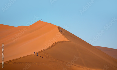 Dead Vlei in Namib desert  peoples climbing to top of dune  Namibia  Southern Africa landscape