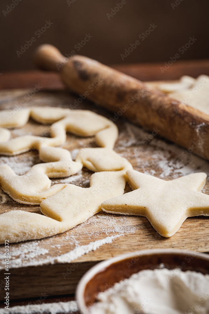 Homemade bakery making Christmas cookies, close-up. New year treat for Santa Claus cooking. Homemade bakery, xmas sweet, winter holidays concept Homemade bakery making Christmas cookies, close-up. New year treat for Santa Claus cooking. Homemade bakery, xmas sweet, winter holidays concept