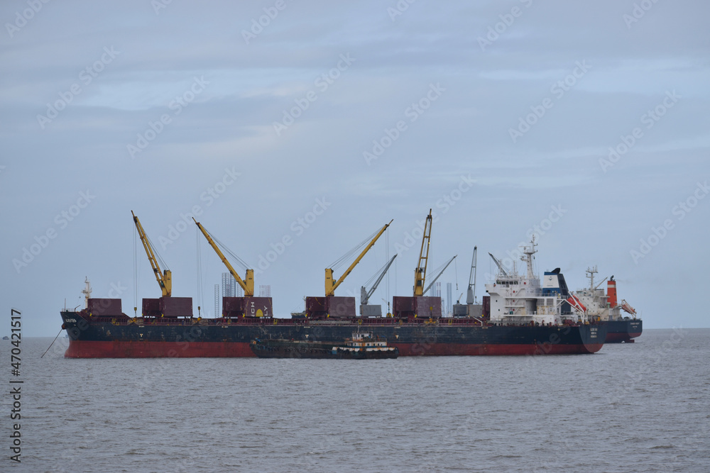 India 18 november 2021 .Loading goods on cargo ship with crane