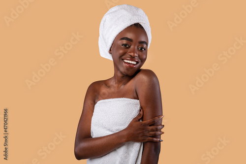 Portrait of beautiful young black woman smiling at studio