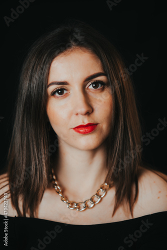 portrait of a beautiful and natural girl with makeup on a black background