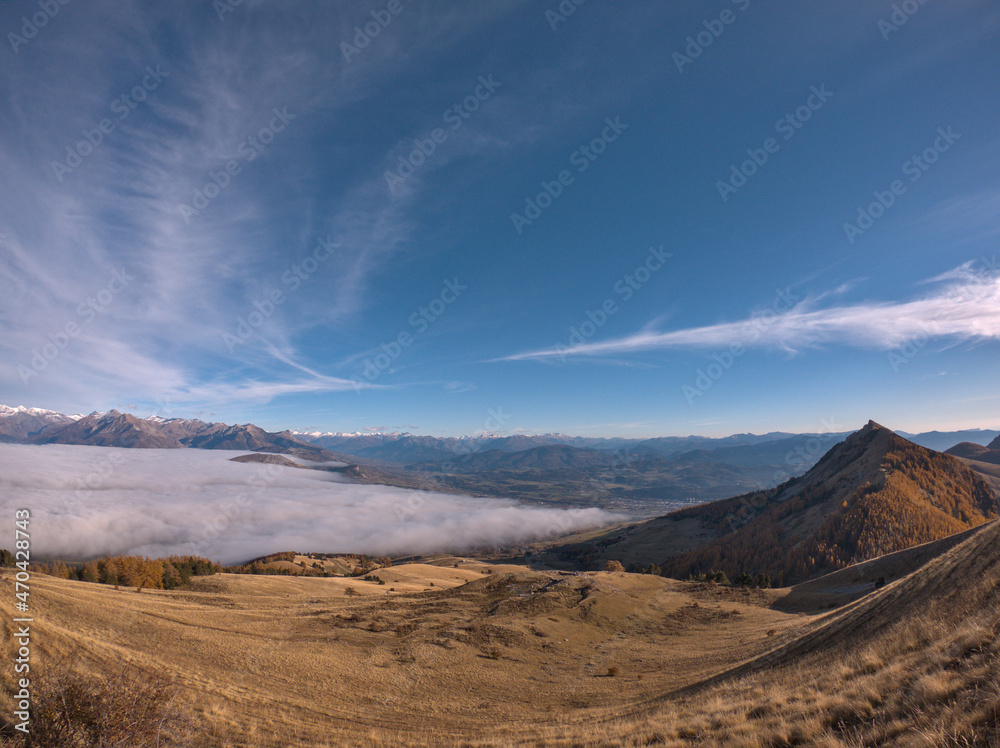 landscape with sea of clouds shot during a hike in peak of Gleize, Champsaur, french alps