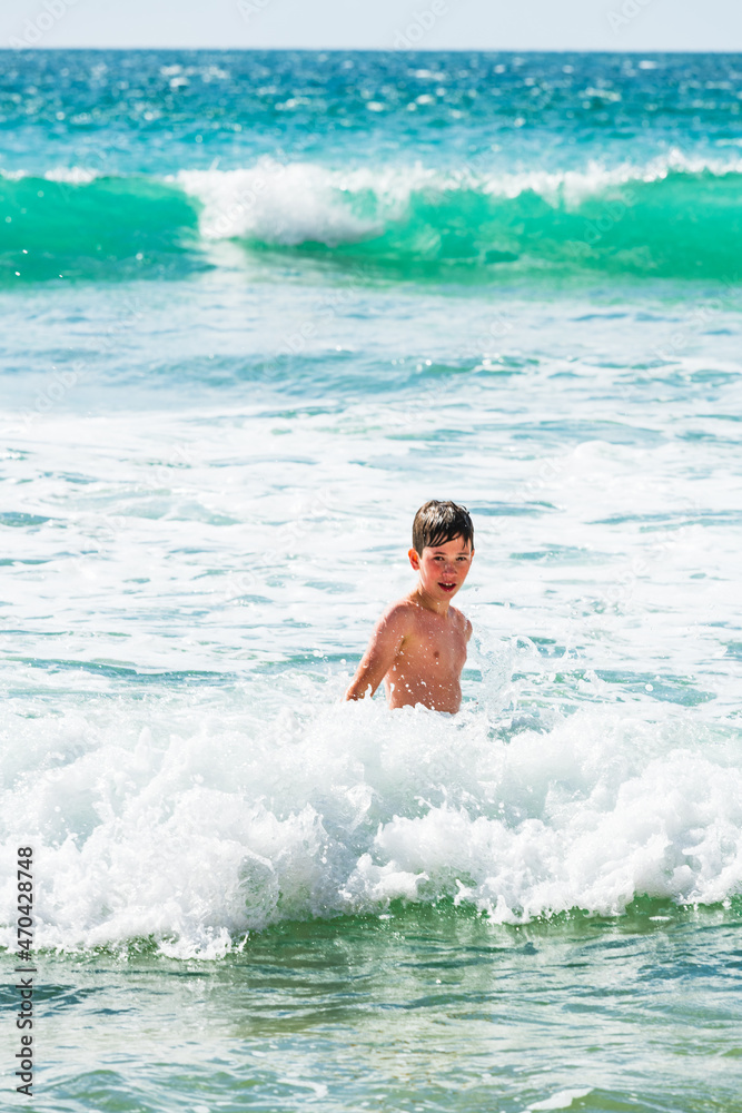 Boy playing in sea, close up, Alvor, Algarve, Portugal, Europe