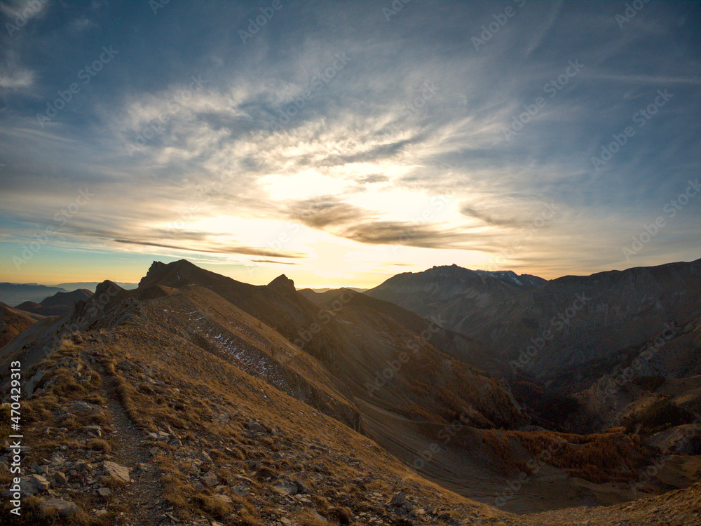 path on a ridge to the sunset shot during a hike in peak of Gleize, Champsaur, french alps
