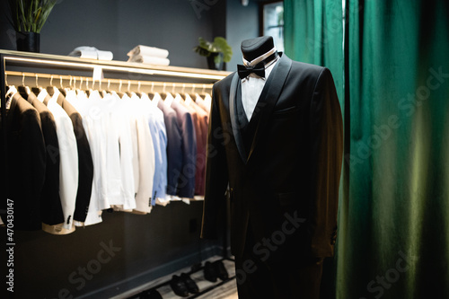 Tuxedo on a mannequin, black suit worn by a mannequin in a boutique,shop for gentlemen