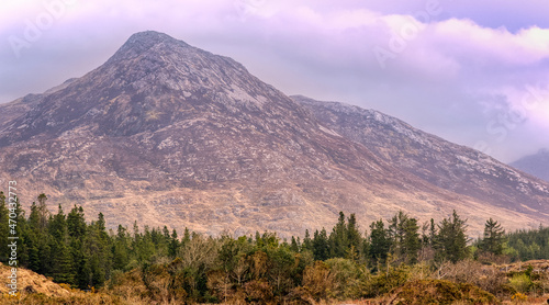 Beautiful landscape scenery of Owenmore river with mountains in the background at Connemara National park in county Galway, Ireland 