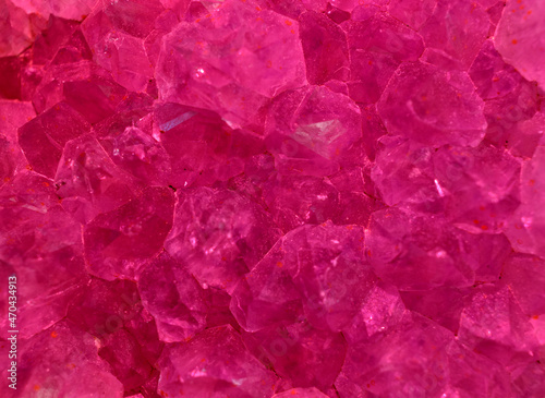 Isolated Macro of Amethyst Crystal Rock Formation Illuminated with Red Light