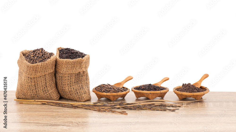 Rice berry,bran and seeds on wood table isolated on white background with clipping path.