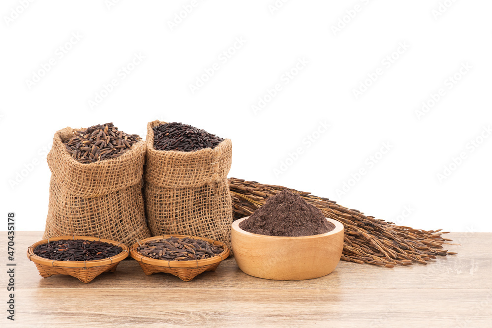 Rice berry,bran and seeds on wood table isolated on white background with clipping path.