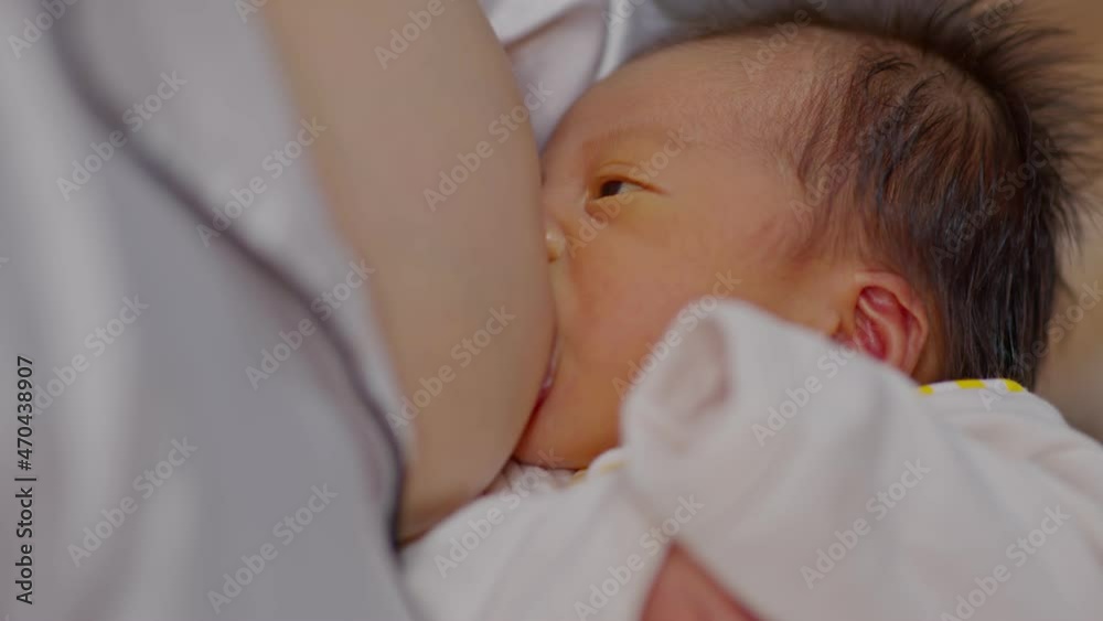 Mother holding her newborn baby and breastfeeding from natural mom breast for making immunity system in children for Healthy Baby,Healthy Baby Concept,Selective focus Mother holding her newborn baby and breastfeeding from natural mom breast for making immunity system in children for Healthy Baby,Healthy Baby Concept,Selective focus