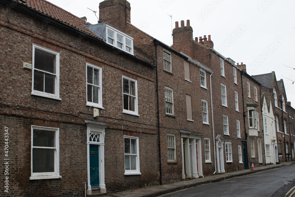 Fototapeta premium Facade of traditional British brick terraced townhouses in York England