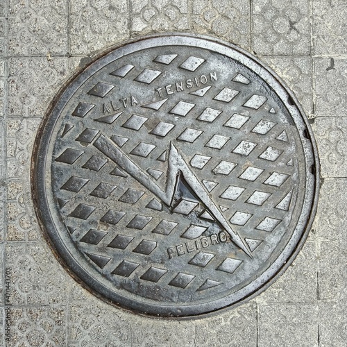  Overhead shot of the metal cover of a sewer in Bilbao.