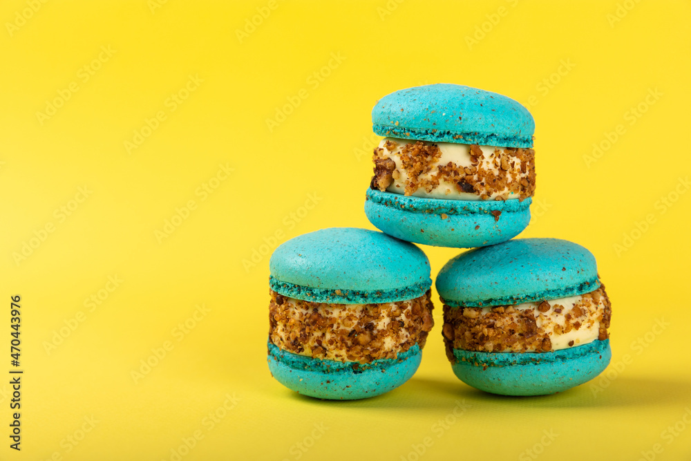 Fototapeta premium macaroon on a yellow background, top view, beautiful macaroons.