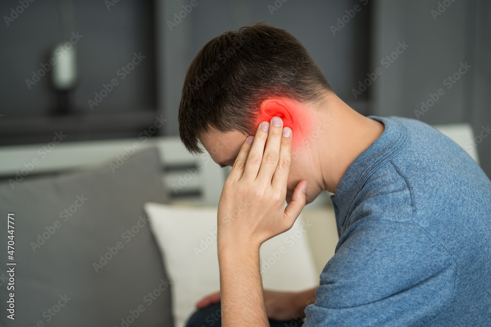 Man with earache, ear pain at home Man with earache, ear pain at home