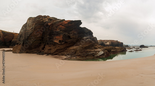 Panoramic of an eroded rock on the beach of the cathedrals.