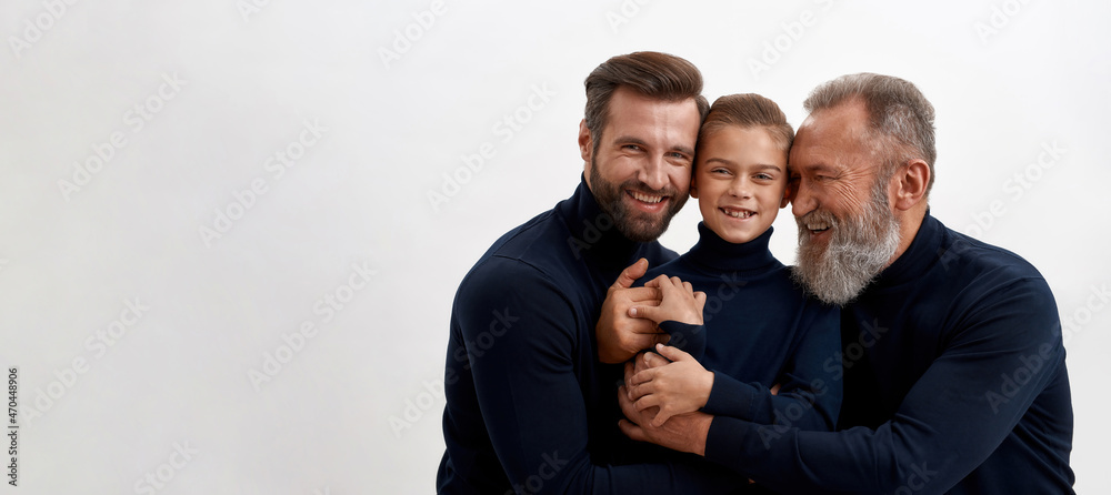 Wide shot of smiling three generations of men together Wide shot of smiling three generations of men together