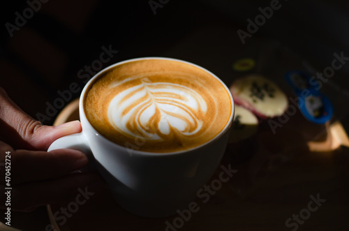 Coffee latte art on wooden table