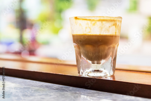 Specialty coffee menu; Dirty coffee is ristretto pouring from coffee machine into cold milk.