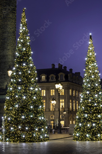 Photography Paris, France - November 20, 2021: Christmas trees by night on Place Vendome in