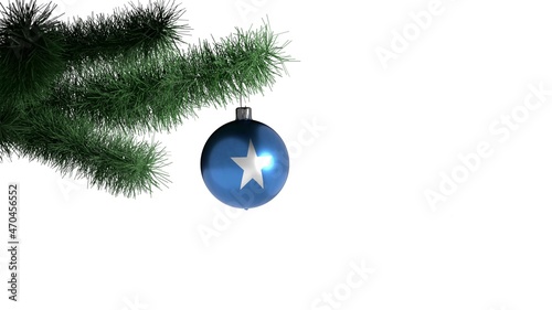 New Year's ball with the flag of Somalia on a Christmas tree branch isolated on white background. Christmas and New Year concept.
