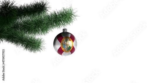 New Year ball with the flag of Florida, USA on a Christmas tree branch isolated on white background. Christmas and New Year concept.