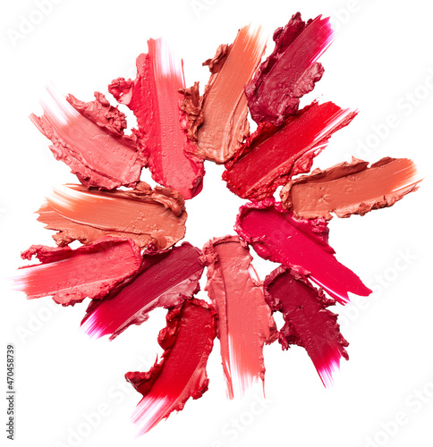 Smudged lipsticks isolated on white background photo