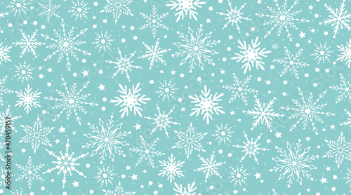 White snow falling on blue sky. Seamless background pattern. Snowflakes design for christmas greeting card banner od package
