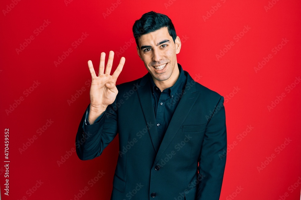 Handsome hispanic man wearing business clothes showing and pointing up with fingers number four while smiling confident and happy. Handsome hispanic man wearing business clothes showing and pointing up with fingers number four while smiling confident and happy.