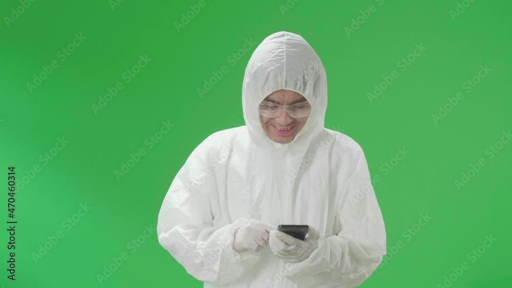Asian Man Wearing Personal Protective Equipment Uniform Ppe And Use Mobile Phone In The Green Screen Studio
Asian Man Wearing Personal Protective Equipment Uniform Ppe And Use Mobile Phone In The Green Screen Studio