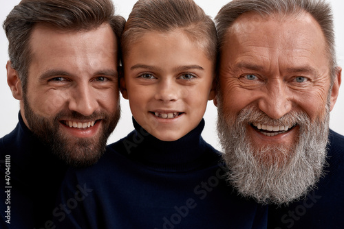 Tableau sur toile Portrait of happy three generations of Caucasian men