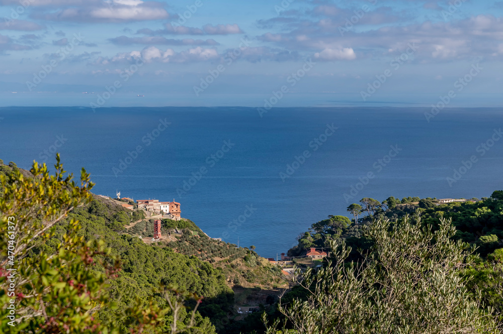Aerial view of the island of Gorgona with the coast of Tuscany in the background, Italy