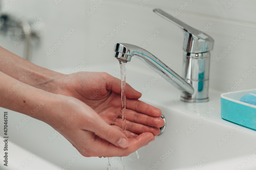 The Girl Washes Her Hands to Avoid Infection With the Virus COVID-19 The Girl Washes Her Hands to Avoid Infection With the Virus COVID-19