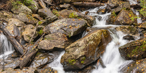 Bolders with a river flowing through in the fall.  
